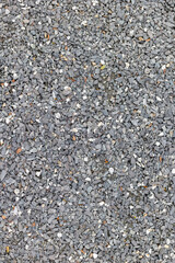 Texture of gray gravel with small stones in natural outdoor setting