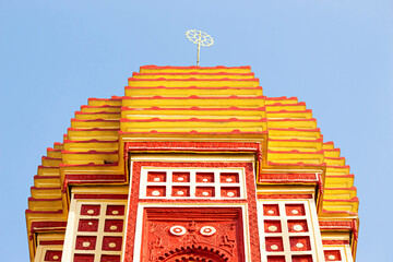 Carved sculptures of childhood forms of Lord Krishna on the terracotta Gopinath Temple,...