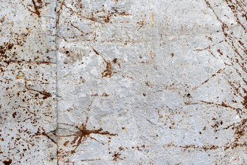 Weathered concrete surface with rust and cracks