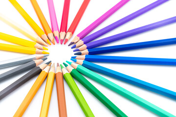 Colourful wooden colored pencils isolated on white background with copy space