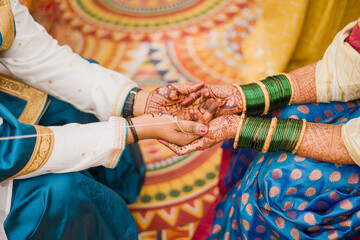 Man and woman holding hand for traditional hindu wedding rituals 