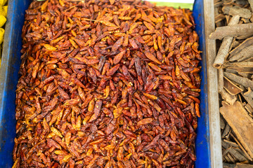 Dried hot pepper spice in a bag for sale at the market.