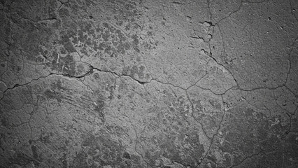 Obraz premium This large, high-resolution image presents a black and white background that highlights the texture of a cement floor, embodying an aged vintage grunge aesthetic