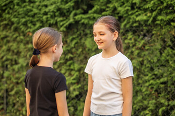 Children enjoying and talking outdoors in a friendly atmosphere