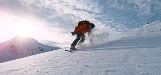 Freeze Motion of Running Snowboarder in Fresh Powder Snow. Austria Alps, Europe.