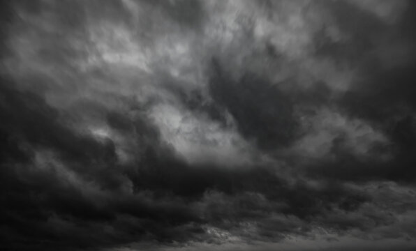 dark dramatic sky with black stormy clouds before rain as abstract background, extreme weather