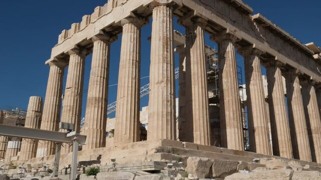 Moving a long a colonnade from the ancient Temple of Hephaestus in Ancient Agora, Athens, Greece