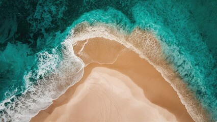 Fototapeta premium Aerial view of turquoise ocean waves meeting sandy shore with swirling patterns, featuring vibrant blue and sandy beige colors in the composition.