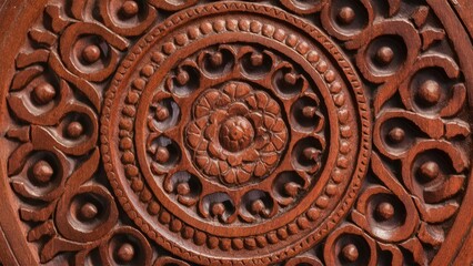 Intricate closeup of ornate solid wood carving featuring circular motifs and floral designs in rich brown tones, centered and detailed.