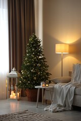 Beautiful Christmas tree and other decor in cozy room. Festive interior design