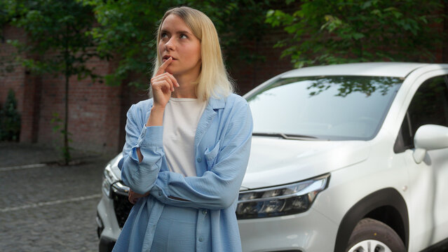 Contemplative Caucasian female pensive driver girl lady wondering woman vehicle owner contemplate in city businesswoman ponder car buyer thinking business automobile problem think solution auto answer