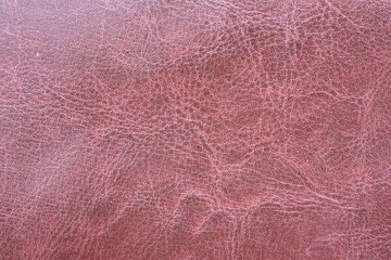 Red toned weathered leather texture. Abstract background and texture for design and ideas