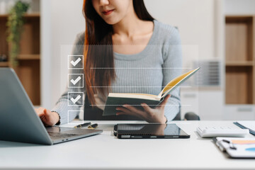 Businessman using tablet to do online checklist survey, doing assessment online survey answer test questions Digital form.