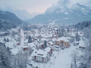A scenic view of a snow-covered town nestled amidst majestic mountains on a winter day