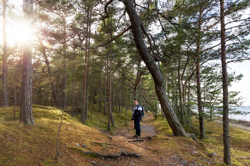 Fototapeta premium A man is walking in the forest, on the seashore. Photo