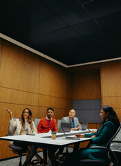 Diverse team engaged in collaborative business meeting discussion