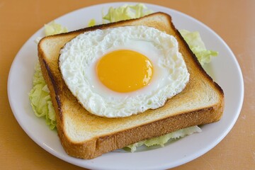 Delicious Sunny Side Up Egg on Toasted Bread with Salad Garnish