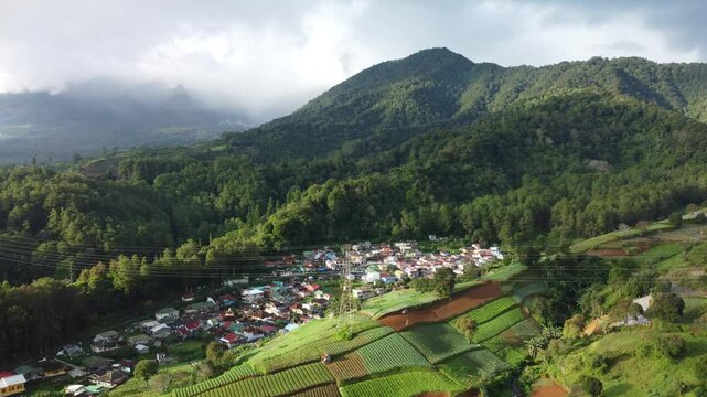 Village in the mountains. Aerial view of residents' houses in the Gunung Gede Pangrango National Park area. Natural View of Puncak Bogor, West Java.