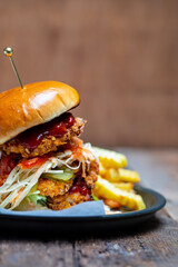 Korean chicken burger with coleslaw and spicy sauce
