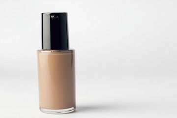 Glass bottle of foundation with pump dispenser isolated on the white background