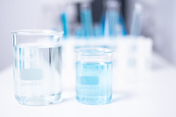 Laboratory beaker blue liquid chemistry chemical research science medical equipment