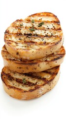 Grilled bread slices stacked neatly, showcasing a golden-brown crust and grill marks.