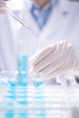 Close-up scientist pipette drop to test tube laboratory research chemistry chemical science research