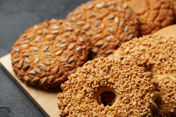 Freshly baked cookies with a variety of textures and flavors on a wooden board