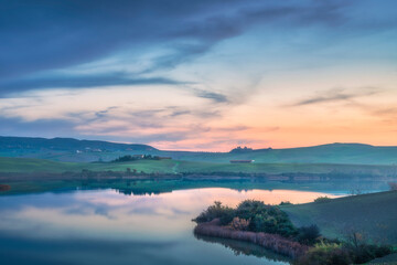 Lake Santa Luce view in a misty sunset. Tuscany, Italy