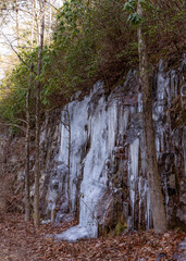 Lula Lake Land Trust, Lookout Mountain, Georgia. A close up of the long spikes of icicles hanging from the cliffsides of the Lula Falls Trail in winter.