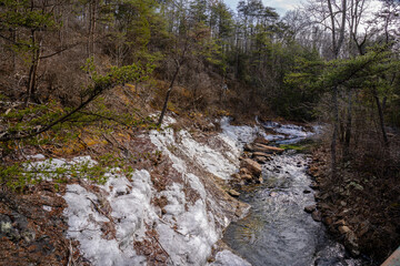 Lula Lake Land Trust, Lookout Mountain, Georgia. Rock Creek looking away from Lula Lake. The banks of the creek are blanketed in patches of ice.