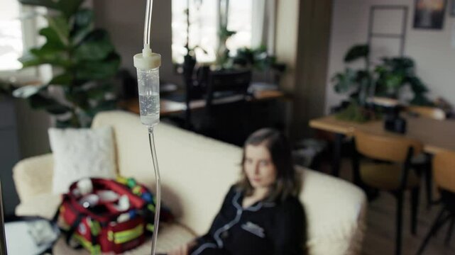 Woman receiving iv infusion at home