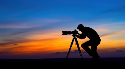 Silhouette of a photographer capturing a sunset landscape with a telescope on a hilltop