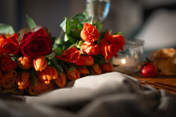 Roses and candlelight for romantic breakfast in bed. Background for valentins day and mothers day