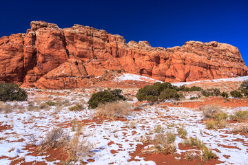A mountain range covered in snow and rocks