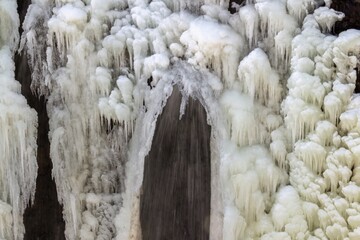 Icicles hang beneath snowy eaves.