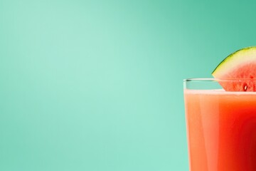 Refreshing drink with vibrant color, garnished with slice of fru