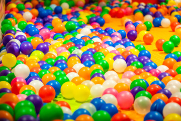A lively ball pit filled with colorful plastic balls for endless fun and exploration.