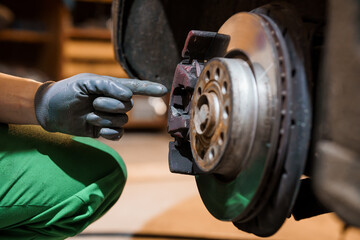 Detailed Inspection of a Car Brake System in an Auto Repair Shop