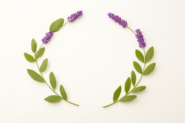 Elegant arrangement of lavender flowers and green leaves on a soft background, suitable for nature-themed designs