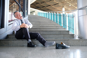 A man falls down the stairs and is injured.