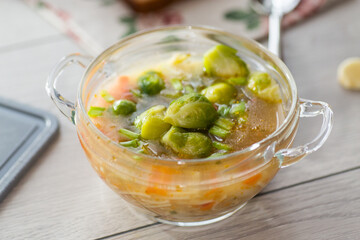 Vegetable Soup with Brussels Sprouts in a Glass Plate