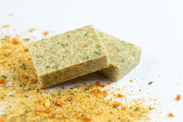 A versatile cube-shaped seasoning consisting of a mixture of vegetables and salt