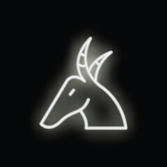 White neon sign showing the head of a capricorn, the tenth astrological sign in the zodiac, on a black background