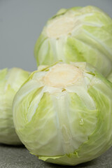 Whole heads of fresh white cabbage close-up.