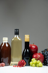 Different types of vinegar. Pomegranate, apple and balsamic vinegars in bottles