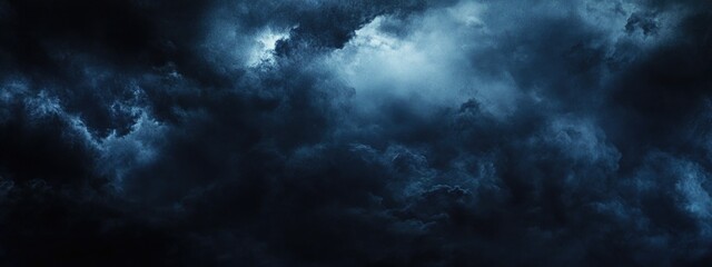Obraz premium Dramatic stormy sea and sky background with moody shades of blue and dark clouds ideal for text overlay and atmospheric design