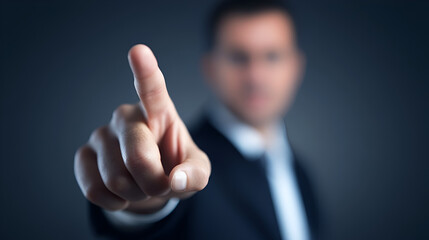 "Close-Up of a Businessman Pointing Forward in a Professional Gesture"

