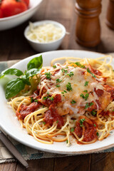 Chicken parmesan with spaghetti noodles and sauce