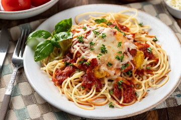 Chicken parmesan with spaghetti noodles and sauce
